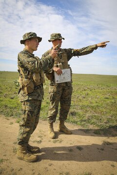 Recruits Jacob R. Kottman and Chainey L. Ellis, (right to left) Platoon 2105, Echo Company, 2nd Recruit Training Battalion, try to determine where their mark is located during the Land Navigation Course at Edson Range, Marine Corps Base Camp Pendleton, Calif., Jan. 22.  Recruits had to utilize teamwork and confidence in each other’s skills while making their way through the course.