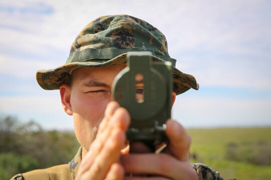 Recruit Chainey L. Ellis, Platoon 2105, Echo Company, 2nd Recruit Training Battalion, uses his compass to navigate to the next mark during the Land Navigation Course at Edson Range, Marine Corps Base Camp Pendleton, Calif., Jan. 22.  Recruits will use these skills taught when they continue their training at the School of Infantry.