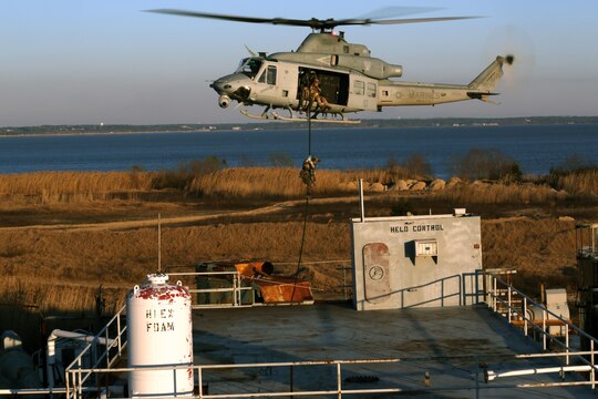 MOBILE, Ala.—A Critical Skills Operator with 3rd Marine Special Operations Battalion, U.S. Marine Corps Forces Special Operations Command, fast-ropes onto a ship here, Feb. 12, 2015. The battalion conducted a Visit, Board, Search and Seizure mission aboard the ship during RAVEN 15-03, a 10-day realistic military training exercise to enhance the battalion’s readiness for worldwide support to global security. (Official U.S. Marine Corps photo by GySgt. Josh Higgins/released)