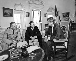 AR8153-A  02 October 1963  President Kennedy meets with the Secretary of Defense and Chairman of the Joint Chiefs of Staff. General Maxwell D. Taylor, Secretary Robert S. McNamara, President Kennedy. White House, Oval Office. Photograph by Abbie Rowe, National Park Service, in the John F. Kennedy Presidential Library and Museum.