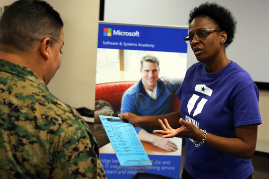 Michelle Howard, right, shares information about some of the education opportunities that are available to Marines during a Transition Resource Fair held, here, by the Personal and Professional Development Branch of Marine and Family Programs Jan. 22.

Howard is a graduation coordinator with Central Texas College at the Joint Education Center here.