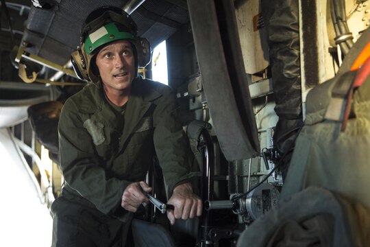 Lance Cpl. Marshall Cheatham, an airframes mechanic with Marine Heavy Helicopter Squadron (HMH) 466, performs maintenance on a CH-53E Super Stallion aboard Marine Corps Air Station Miramar, California, July 2. The aircrew prepares the aircraft for night fast-rope training on Marine Corps Base Camp Pendleton, California. (U.S. Marine Corps photo by Sgt. Lillian Stephens/Released)