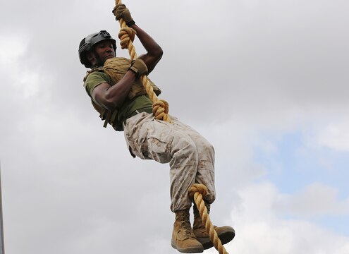 Marines and Sailors competed in the Military Battle Challenge, Commanding General’s Cup competition at the 11 Area shopping center, July 22. Competitors raced to complete a series of tasks such as scaling a rope net, moving five 40lb. fuel canisters and shooting laser guns. The Military Battle Challenge is a new obstacle course race that tests competitor’s endurance, strength and marksmanship skills against the clock and each other.