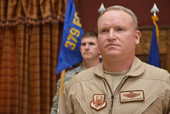 Lt. Col Ronald Schochenmaier, 22d Expeditionary Air Refueling Squadron commander, listens to the citation after unveiling the squadron flag prior to assuming command July 24th 2015 at Al Udeid Air Base, Qatar. The 22d was first formed in 1939 primarily as a bomb squadron for World War II. In 2002 it was inactivated as the 22d Air Refueling Squadron and is now re-designated as the 22d EARS supporting operations from Al Udeid Air Base. (U.S. Air Force photo/Staff Sgt. Alexandre Montes)