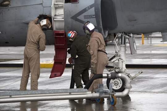 Marines with Station Fuels Division refuel a Marine Tactical Electronic Warfare Squadron 2 (VMAQ-2) EA-6B Prowler aboard Marine Corps Air Station Iwakuni, Japan, July 22, 2015. The aircraft have refueled on the air station before, but were unable to utilize the hot pits due to their size. The Prowlers, stationed aboard MCAS Cherry Point, N.C., are in Iwakuni in support of the Unit Deployment Program.
