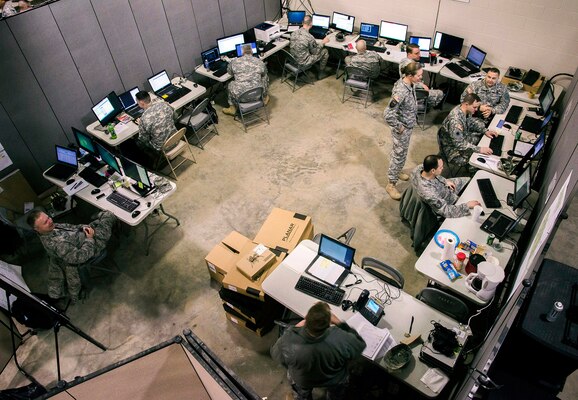 Members of the Ohio National Guard Computer Network Defense Team conduct cyberdefense operations during exercise Cyber Shield 2015 at Camp Atterbury, Ind., March 20. The exercise was designed to develop the defensive skills of soldiers and airmen tasked with securing their organizations’ computer networks. U.S. Army National Guard photo by Staff Sgt. George Davis