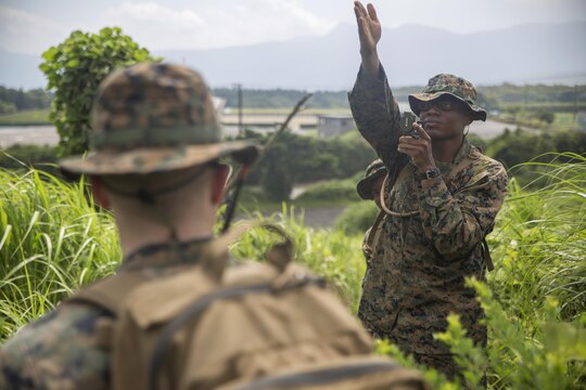 Lance Cpl. Jacob A. Dowling, a motor transport mechanic with Combat Logistics Company 36, shoots an azimuth reading with his compass during Exercise Dragon Fire 2015 at Combined Arms Training Center Camp Fuji, Japan, July 27. Marines and Sailors refreshed their land navigation skills during the exercise along with many other skill sets. CLC-36 conducts this exercise annually to further develop their service members’ combat mindset to prepare them for the mental and physical stress of a combat zone.