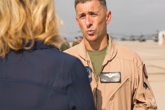 Birdget Naso, a military reporter with NBC 7 Sand Diego, interviews Lt. Col. Chad Vaughn, an F-35B Lightning II pilot with Marine Aircraft Group (MAG) 13, during Marine Corps Air Station Miramar Media Day aboard MCAS Miramar, California, July 29. The MCAS Miramar Media Day allowed the media an opportunity to delve deeper into the moving parts that make the air station and the Marine Corps work. (U.S. Marine Corps photo by Cpl. Alissa P. Schuning/Released)