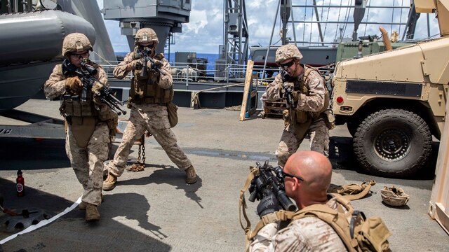 U.S. Marines with Kilo Company, Battalion Landing Team 3rd Battalion, 1st Marine Regiment, 15th Marine Expeditionary Unit, rehearse urban operation tactics aboard USS Rushmore at sea in the Pacific Ocean, June 1, 2015. BLT 3/1 constantly trains for the unknown in order to respond to the needs of the MEU while deployed. These drills keep the Marines in a constant state of combat readiness while at sea.