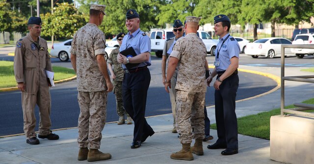 Col. Peter D. Buck and Col. Robert D. Cooper greet United Kingdom Royal Air Force officers Air Commodore Harvey Smyth, Group Capt. Paul Godfrey, and Group Capt. Ian Townsend as they arrive at Headquarters and Headquarters Squadron, June 16. The officers visited Marine Corps Air Station Beaufort to familiarize themselves with the integrated F-35B Lightning II Joint Strike Fighter Program. Buck is the commanding officer of MCAS Beaufort, Cooper is commanding officer of Marine Aircraft Group 31 and Smyth is the lightning force commander, responsible for the entire F-35 program in the Royal Air Force. Godfrey is the current group captain lightning, responsible for everything to do with the F-35 aboard MCAS Beaufort, and Group Capt. Ian Townsend is the incoming group captain lightning.