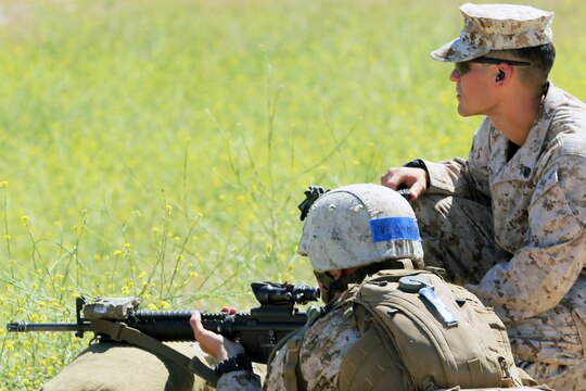 Combat instructors with Infantry Training Battalion, Bravo Company, guide new Marines through their first week in the field, reaffirming the basics of shooting and zeroing their weapons, Range 214, June 19.

Combat instructors teach young, fresh out of boot camp Marines in the skills Marines need to succeed in combat. These skills include land navigation, combat conditioning and combat marksmanship training with individual and crew-served weapons such as the M16A4 service rifle, M203 grenade launcher and AT-4 rocket launchers.