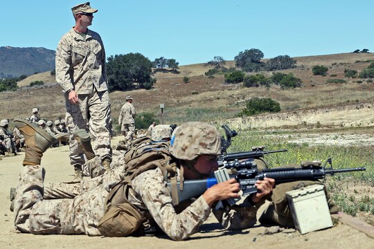 Combat instructors with Infantry Training Battalion, Bravo Company, guide new Marines through their first week in the field, reaffirming the basics of shooting and zeroing their weapons, Range 214, June 19.

Combat instructors teach young, fresh out of boot camp Marines in the skills Marines need to succeed in combat. These skills include land navigation, combat conditioning and combat marksmanship training with individual and crew-served weapons such as the M16A4 service rifle, M203 grenade launcher and AT-4 rocket launchers.