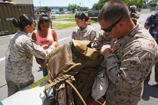 Marines with Combat Logistics Battalion 6, conduct a search at the evacuation command center during a simulated embassy evacuation aboard Naval Air Station Oceana, Va. The ECC is part of a week-long Special Purpose Marine Air Ground Task Force - Crisis Response- Africa certification exercise, the final step in the pre-deployment training. (U.S. Marine Corps photo by Staff Sgt. Vitaliy Rusavskiy/ Released)