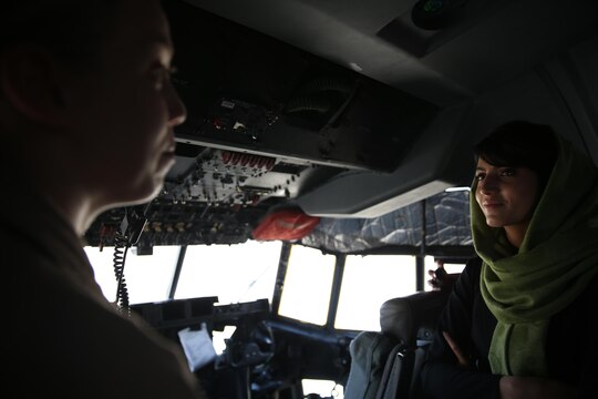 Capt. Niloofar Rahmani, the first female fixed-wing pilot in the Afghan Air Force, speaks with a female pilot from Marine Aerial Refueler Transport Squadron 352 in a KC-130J Super Hercules aboard Marine Corps Air Station Miramar, Calif., March 9. Rahmani received the 2015 International Women of Courage award by the Department of state for her courage in advocating women’s rights despite personal risk.