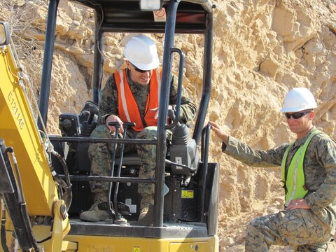 Major Gen. Vincent Coglianese, left, 1st Marine Logistics Group Commanding General, talks with a combat engineer Marine with 7th Engineer Support Battalion, 1st MLG, during a visit to El Centro, California, Feb. 26, 2015.  Marines arrived during January, providing engineering support to construct an all-weather road in El Centro, California, along the United States-Mexico border to increase U.S. border patrol mobility and support the interdiction of transnational threats. (U.S. Marine Corps photo by 1st Lt. Thomas Gray/ Released)