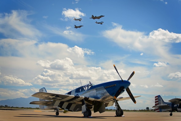 A Heritage Flight formation consisting of an F-16CM Fighting Falcon, F-22 Raptor, and F-86 Sabres fly through the sky during the Heritage Flight Certification and Training Course at Davis-Monthan AFB, Ariz., Feb. 27, 2015. The F-16 Viper Demo Team trained for several days during the course, perfecting their demonstration and learning to fly Heritage Flights. (U.S. Air Force photo by Senior Airman Jensen Stidham/Released)