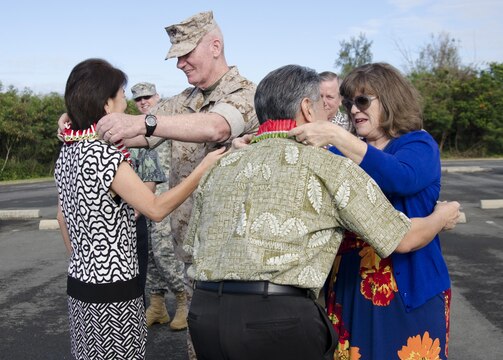 Lt. Gen. John A. Toolan, commanding general, U.S. Marine Corps Forces, Pacific, and his spouse, Helen, welcome Hawaii Gov. David Ige and his spouse, Dawn, to Marine Corps Base Hawaii at the Pacific War Memorial, March 16, 2015. (U.S. Marine Corps photo by Kristen Wong/Released)