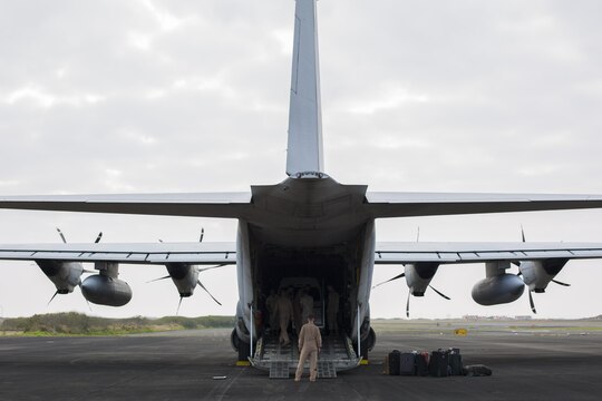 Marines with Marine Aerial Refueler Support Squadron 152 load equipment and luggage onto a Lockheed KC-130J Hercules aircraft in Iwo To, Japan, March 21, 2015. The C-130 is unique for its capability to provide medical evacuation, parachute insertions, and being able to use unprepared runways for takeoffs and landings.