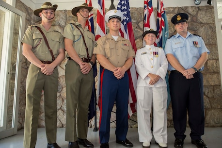 Left to right: Lieutenant Luke Morgan, Alpha Troop Commander, 1st Transport Squadron, 1st Combat Service Support Battalion; Lt. Stephen Weir, operations officer with 105 Signal Squadron, 1st Combat Signal Regiment; Sgt. Bradley S. Minge, color sergeant with Headquarters and Support Company, 1st Battalion, 4th Marine Regiment, Marine Rotational Force - Darwin; Lt. Katherine Newson, maritime logistics officer with Headquarters Northern Command, Joint Operations Command - Australian Theatre;  Flight Lieutenant Heath Fulton, operations officer with Joint Task Force 639 ACCE, Royal Australian Air Force Base Darwin, Darwin, Australia. The service members stand before the new location for the national and ensign flags during a ceremony to mark the relocation of service flags April 26 at the Darwin Memorial United Church, Darwin, Australia. The service of worship and ceremony was held in order to relocate the flags to the foyer to create more room for the "Fujita" Peace and Reconciliation Exhibition. Events in the community allow Marines to learn about the history the U.S. and Australia share, and to further the longstanding relationship between the U.S. and Australia.