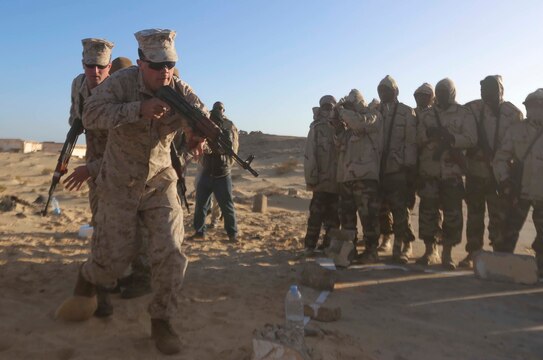 U.S. Marines with Special-Purpose Marine Air-Ground Task Force Crisis Response-Africa demonstrate close-quarters combat techniques to Mauritanian Fusilier Marins in Nouadhibou, Mauritania, Feb. 20, 2015. Approximately 20 Marines, Sailors and Coastguardsmen with SPMAGTF-CR-AF conducted infantry training and small boat operations with the Mauritanians to increase their capabilities and regional stability. (Courtesy photo)