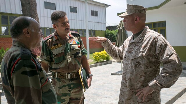 Lt. Gen. John E. Wissler, right, talks to Maj. Gen. J S Sandhu, left, and Col. Man Raj Singh Mann about the capabilities the MV-22B Osprey tilt-rotor aircraft brings to the relief efforts May 5 at Tribhuvan International Airport. After Nepal was struck by a 7.8 magnitude earthquake April 25 an international humanitarian assistance and disaster relief operation has been taking place in Nepal. The Nepalese Government requested the U.S. Government’s help after the earthquake. USAID is a U.S. Government agency that gives civilian foreign aid in time of natural disaster. Sandhu is the Indian Army Task Force commander. Mann is the defense advisor for the embassy of India in Nepal. Bonar is the sergeant major of III Marine Expeditionary Force. (U.S. Marine Corps photo by Cpl. Isaac Ibarra/Released)