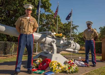 Lieutenant Colonel Eric J. Dougherty and Sgt. Maj. Marcus A. Chestnut stand at parade rest during a service commemorating the 73rd Anniversary of the Battle of the Coral Sea May 8 at USS Peary Gun Memorial, Darwin, Northern Territory, Australia. The Battle of the Coral Sea was a series of naval engagements, between the U.S. and Australia against Japan, which occurred May 4 to May 8, 1942 on the northeast coast of Australia. Community engagements between the U.S. military and Australian Defence Force reinforce relations that date back to when both countries fought alongside each other in World Wars I and II, Korea, Vietnam, Iraq and Afghanistan together. Dougherty is the commanding officer of 1st Battalion, 4th Marine Regiment, Marine Rotational Force – Darwin.  Chestnut is the sergeant major of 1st Battalion, 4th Marines, MRF-D.
