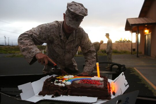 Cpl. Justin Jeffcoat, a wireman with 3rd Battalion, 3rd Marine Regiment, and a Dallas native, cuts the cake during a birthday celebration during training exercise Lava Viper, one of the staples of their pre-deployment training, aboard Pohakuloa Training Area, Hawaii, Oct. 22, 2015. Lava Viper provides the Hawaii-based Marines with an opportunity to conduct various movements, live-fire and tactical training before departing for Integrated Training Exercise aboard Marine Air-Ground Combat Center Twentynine Palms, Calif., where the battalion will train and be evaluated as a whole. "Trinity" strives to fight and win on both the tactical and ethical battlefield, always cultivating the values of honor, courage, and commitment, ultimately producing morally guided citizens whose obligations and responsibilities supersede rights and privileges. (U.S. Marine Corps photo by Lance Cpl. Harley Thomas)
