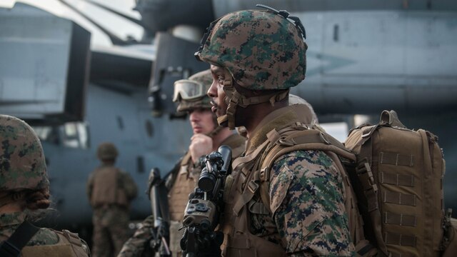 Marines and sailors with the 15th Marine Expeditionary Unit wait for directions during a mass-casualty drill on the flight deck of the USS Essex (LHD 2).The Marines and Sailors honed their skills to become quicker and more efficient should a situation arise where medical attention is needed. The 15th MEU is currently deployed in the Indo-Asia-Pacific region to promote regional stability and security in the U.S. 7th Fleet area of operations. 