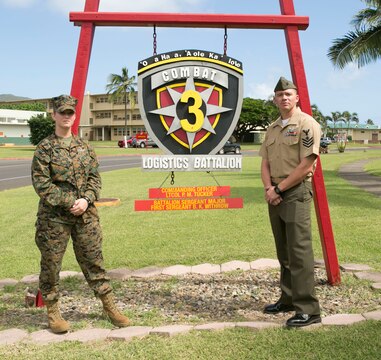 MARINE CORPS BASE HAWAII - Petty Officer 1st Class Janelle Mattern, the leading petty officer of Medical Logistics, Support Company, Combat Logistics Battalion 3, and Petty Officer 1st Class Jonathon Garcia, the senior enlisted advisor for the III Marine Division Chaplain Office, stand in front of CLB-3’s unit sign aboard Marine Corps Base Hawaii, Nov. 5, 2015. These sailors rushed across the street to the scene where Robin Lopes, a sixth grade teacher at Mokapu Elementary School, was lying on the ground after she had a bicycle accident in the school parking lot. “I’ll always tell people from now on if they were to get hurt, pray there is a Marine Corps base around because literally a corpsman came and I was surrounded by Marines,” Lopes said. (U.S. Marine Corps photo by Lance Cpl. Zachary Orr)