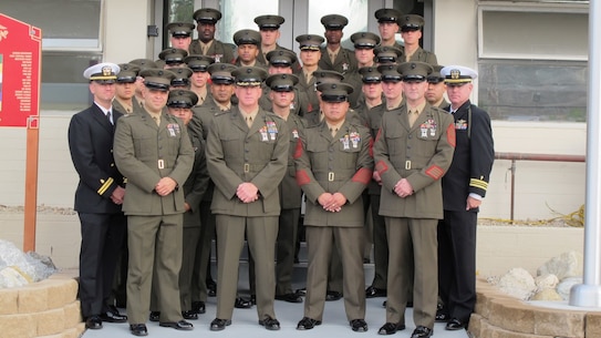 Camp San Mateo-A group of Marines and Sailors proudly display the wearing of the French Fourragere after receiving it by the Commanding Officer of the Fighting Fifth Marine Regiment during a Welcoming Ceremony to our Corps' most decorated Regiment.