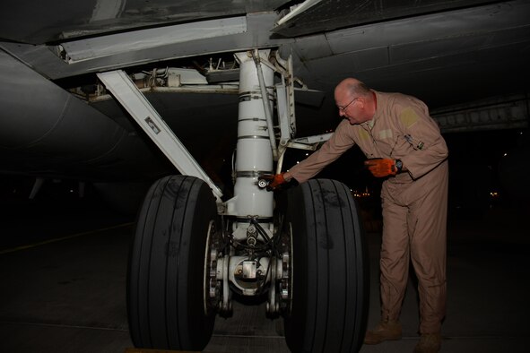 Master Sgt. Curtis Stark, 7th Expeditionary Air Combat Control Squadron superintendent, conducts a pre-flight inspection on the exterior of an E-8C Joint Surveillance Target Attack Radar System aircraft at Al Udeid Air Base, Qatar Nov. 14. Stark has deployed 17 times with JSTAR aircraft in support of contingency operations and has accumulated more than 4,000 combat flying hours. After nearly 30 years of service he plans to retire from the Air Force in March 2016. (U.S. Air Force photo by Tech. Sgt. James Hodgman/Released)