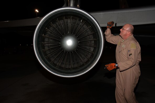 Master Sgt. Curtis Stark, 7th Expeditionary Air Combat Control Squadron superintendent, conducts a pre-flight inspection on the exterior of an E-8C Joint Surveillance Target Attack Radar System aircraft at Al Udeid Air Base, Qatar Nov. 14. Stark has deployed 17 times with JSTAR aircraft in support of contingency operations and has accumulated more than 4,000 combat flying hours. After nearly 30 years of service he plans to retire from the Air Force in March 2016. (U.S. Air Force photo by Tech. Sgt. James Hodgman/Released)