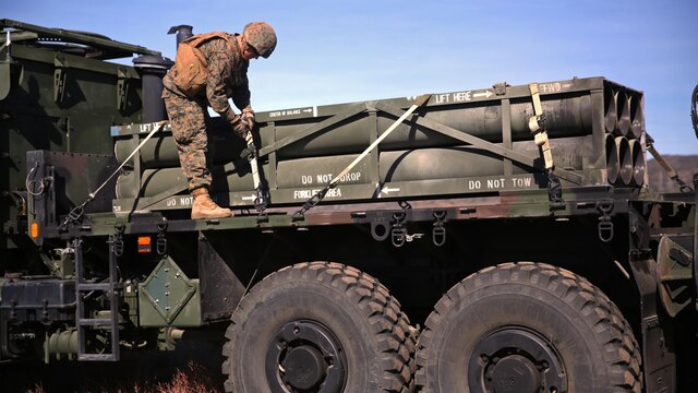 A Marine with Battery Q, 5th Battalion, 11th Marine Regiment, 1st Marine Division, checks the straps to secure a rocket pod for a High Mobility Artillery Rocket System during the 5/11 Command Post Exercise aboard Marine Corps Base Camp Pendleton, Calif., Nov. 18, 2015. The CPX provided an opportunity for the Marines to refresh their skillsets in preparation for exercise Steel Knight 2016.