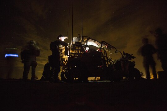 Marine Raiders with Marine Special Operations Company Charlie, 1st Marine Raider Battalion, U.S. Marine Corps Forces, Special Operations Command, process intelligence and set up a visual tele-communication feed after a notional direct-action night raid, a part of a Company Collective Exercise, Oct. 20, 2015, along the Arizona-California state line.