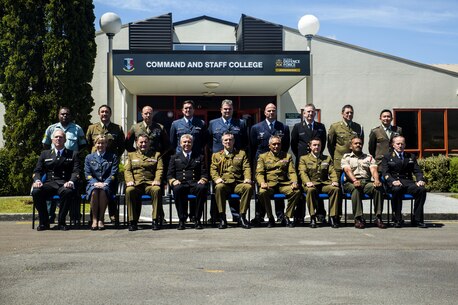 Lt. Gen. Tim Keating, center, takes a photo with the graduating class of the Defence Force Command and Staff College, Wellington, New Zealand, Nov. 19, 2015. Sgt. Maj. Christian L. Charkowski, in the second row, third from left, was the first U.S. Marine and second U.S. service member to graduate from the course. He attended the Joint Warrant Officers’ Advanced Course, where the objectives were to prepare senior level leaders for senior strategic advisory positions, increase the students’ knowledge of regional security for the Pacific Southwest, and provide insight into the workings of the government. Charkowski, from Madison, Wisconsin, is the battalion sergeant major for 3rd Combat Assault Battalion, 3rd Marine Division, III Marine Expeditionary Force. Keating is the chief of defence for the New Zealand Defence Force. (Marine Corps. photo by Cpl. Tyler S. Giguere/Released)