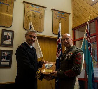U.S. Marine Corps Sgt. Maj. Christian L. Charkowski, right, presents a plaque to New Zealand Defence Force Commander Nigel Philpott at the Defence Force Command and Staff College, Wellington, New Zealand, Nov. 19, 2015. Charkowski is the first U.S. Marine and second U.S. service member to graduate from the college. He attended the Joint Warrant Officers’ Advanced Course, where the objectives were to prepare senior level leaders for senior strategic advisory positions, increase the students’ knowledge of regional security for the Southwest Pacific and provide the students with insight into the workings of the government. Charkowski, from Madison, Wisconsin, is the battalion sergeant major for 3rd Combat Assault Battalion, 3rd Marine Division, III Marine Expeditionary Force. Philpot, from Wellington, New Zealand, is the commandant of the Defence Force Command and Staff College. (Marine Corps. photo by Cpl. Tyler S. Giguere/Released)