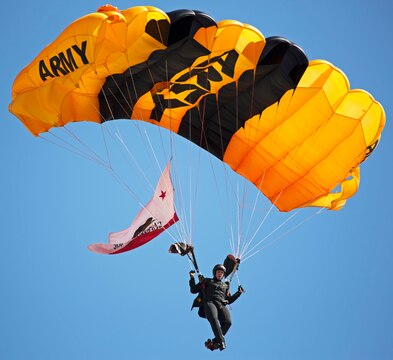A member of the Army’s Golden Knights parachute team performs during the 2015 Miramar Air Show aboard Marine Corps Air Station Miramar, Calif., Oct. 3. The demonstration team jumps from at least 12,000 feet to the target center on the ground and consists of active duty soldiers. (U.S. photo by Sgt. Uriel Avendano/Released)