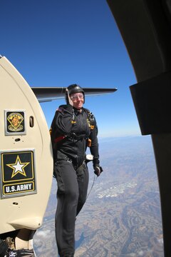 A member of the Army’s Golden Knights parachute team begins a jump sequence during the 2015 MCAS Miramar Air Show aboard Marine Corps Air Station Miramar, Calif., Oct. 3. The demonstration team jumps from at least 12,000 feet to the target center on the ground and consist of active duty soldiers. (U.S. Marine Corps photo by Cpl. Alissa P. Schuning/Released)