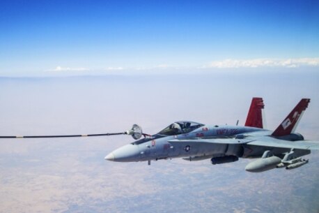 U.S. Marine Corps F/A-18s with Marine Fighter Attack Squadron 232 link up and perform an Air to Air refuel with a Royal Canadian Air Force CC-150 Polaris air-to-air refueller during a combat mission in the skies of Iraq on July 19, 2015. The ‘Red Devils’ of VMFA-232 are currently deployed with the Special Purpose Marine Air Ground Task Force-Crisis Response-Central Command and provide offensive strike and close air support to Operation Inherent Resolve and the global fight against the Islamic State of Syria and the Levant. (Courtesy Photo by Op IMPACT)