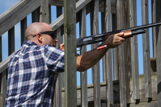 1st Lt. Austin Mass fires a shotgun at a moving target during a skeet range at Marine Corps Air Station Cherry Point, N.C., Oct. 7, 2015. Marines with 2nd Low Altitude Air Defense Battalion held a weapons safety class and participated in the range as part of their Firearms Mentorship Program to promote proper weapons safety and education in a recreational manner. The program allows Marines to maintain their basic rifleman skills and receive further education on safety measures while handling weapons. Mass is a logistics officer with the battalion. (U.S. Marine Corps photo by Cpl. N.W. Huertas/Released)   