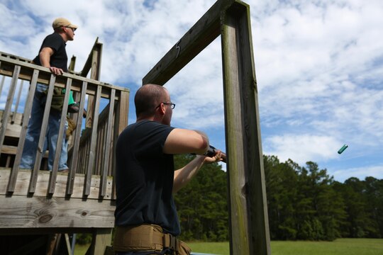 Lance Cpl. Stephen Gomes resets after shooting at a moving target during a skeet range at Marine Corps Air Station Cherry Point, N.C., Oct. 7, 2015. Marines with 2nd Low Altitude Air Defense Battalion held a weapons safety class and participated in the range as part of their Firearms Mentorship Program to promote proper weapons safety and education in a recreational manner. The program allows Marines to maintain their basic rifleman skills and receive further education on safety measures while handling weapons. Gomes is a cyber-networks operator with the battalion.(U.S. Marine Corps photo by Cpl. N.W. Huertas/Released)    