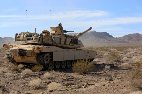 An M1A1 Main Battle Tanks with Company A, 1st Tank Battalion, 1st Marine Division, stops in order to provide fire support for British Royal Marines with 42 Commando Group during Exercise Black Alligator 2015 aboard Marine Air Ground Combat Center Twentynine Palms, Calif., Sept. 30, 2015. The exercise gave 1st Tanks an opportunity to hone and showcase their support capabilities, while building upon an already established relationship with the Royal Marines.     (U.S.Marine Corps photo by Cpl. Demetrius Morgan/RELEASED)
