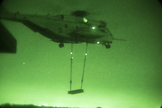 A CH-53E Super Stallion helicopter from Marine Medium Tiltrotor Squadron (VMM) 166 (Reinforced), 3rd Marine Aircraft Wing, prepares to lift a 6,200 pound steel girder during external lift training aboard Marine Corps Air Station Miramar, Calif., Oct. 14. The squadron conducted the training to maintain proficiency in transporting external cargo. (Official Marine Corps photo by Sgt. Brian Marion/Released)