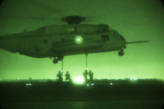 Marines with Combat Logistics Battalion (CLB) 13 attach a 6,200 pound steel girder to a CH-53E Super Stallion helicopter from Marine Medium Tiltrotor Squadron (VMM) 166 (Reinforced), 3rd Marine Aircraft Wing, during external lift training aboard Marine Corps Air Station Miramar, Calif., Oct. 14. The squadron conducted the training to maintain proficiency in transporting external cargo. (Official Marine Corps photo by Sgt. Brian Marion/Released)