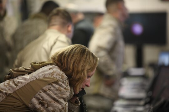 Lt. Cmdr. Laura Anderson coordinates medical support for the aviation combat element during Wing Exercise 15, at Marine Corps Air Station Cherry Point, North Carolina, Oct. 13, 2015. Marines assigned to battle staff positions participated in operational planning teams requiring staff input across the entirety of 2nd MAW.  Medical planners were a vital link in the exercise as they coordinated a multitude of casualty evacuations and general health and welfare for U.S. Marines and Sailors within the ACE. 