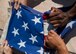 Members of the Nellis Air Force Base Honor Guard practice the ceremonious folding of the U.S. flag at Nellis AFB, Nev., Oct. 13, 2015. The team utilizes either the two-person or six-person flag folding sequence during a retirement or funeral. (U.S. Air Force photo by Staff Sgt. Siuta B. Ika)
