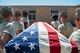 Members of the Nellis Air Force Base Honor Guard practice properly carrying a casket at Nellis AFB, Nev., Oct. 13, 2015. For decades, the Nellis AFB Honor Guard has imparted tradition, ceremony and dignity to military funerals, public events and formal occasions. (U.S. Air Force photo by Staff Sgt. Siuta B. Ika)