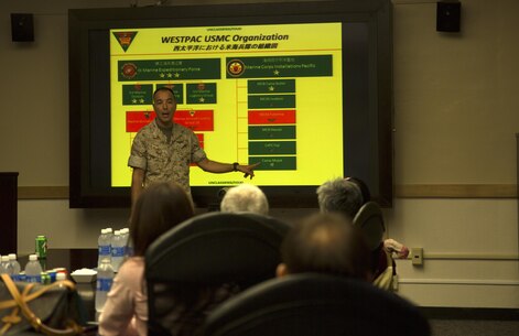 Col. Peter Lee explains the history of Marine Corps Air Station Futenma to members of the Okinawa Prefecture Defense Association during an educational tour Oct. 22 on MCAS Futenma, Okinawa, Japan. Lee highlighted the Marines’ contribution to the Okinawa community as well as disaster relief efforts and operational capabilities of the air station in the Asia-Pacific region. After the presentation, Lee answered the members’ questions before they boarded a bus for a tour of the installation. Lee is the commanding officer of MCAS Futenma, Marine Corps Installations Pacific and a New Rochelle, N.Y., native.
