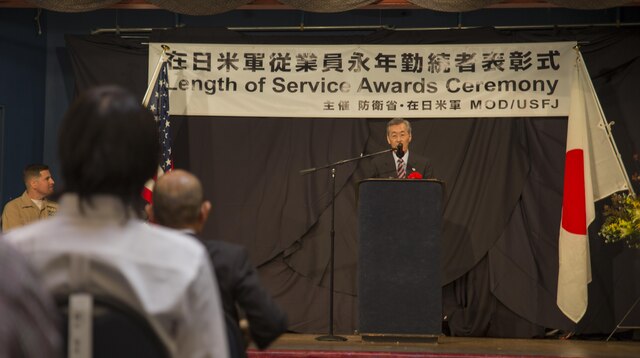 Yoshihiko Fukuda, Mayor of Iwakuni City, addresses attendees during the Length of Service Award Ceremony at the Club Iwakuni ballroom at Marine Corps Air Station Iwakuni, Japan, Oct. 22, 2015. The Length of Service Award Ceremony recognizes the Japanese civilian’s dedication and passion while working on the installation. Station and city officials expressed their appreciation towards the attendees for their efforts and contribution to the air station.