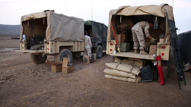 Marines with Alpha Battery, 3rd Low Altitude Air Defense Battalion, pack before moving to their defensive positions during the National Training Center Rotation 16-01 on Fort Irwin, Calif., Oct. 19. This was the first time in more than 10 years that a Marine LAAD unit participated in this exercise.
